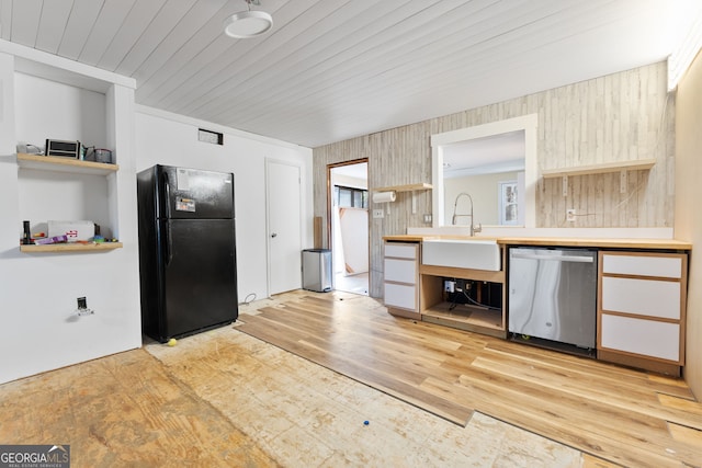 kitchen featuring sink, black fridge, light hardwood / wood-style flooring, wooden ceiling, and dishwasher