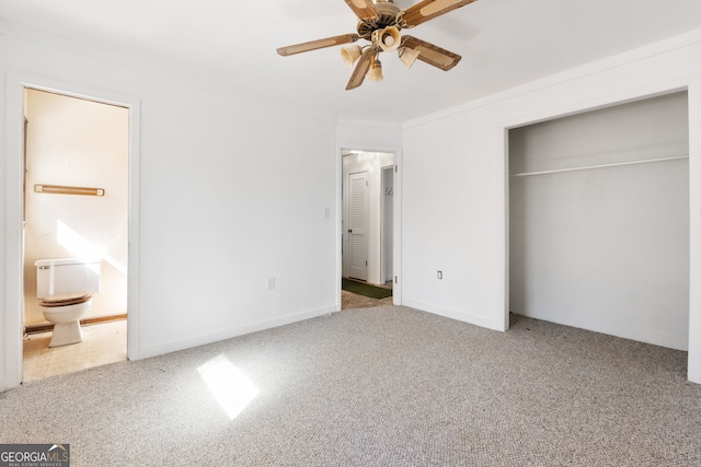 unfurnished bedroom featuring connected bathroom, ornamental molding, light colored carpet, ceiling fan, and a closet