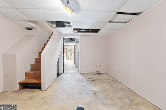 basement featuring a paneled ceiling