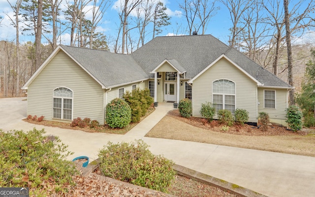 view of front of house featuring a shingled roof