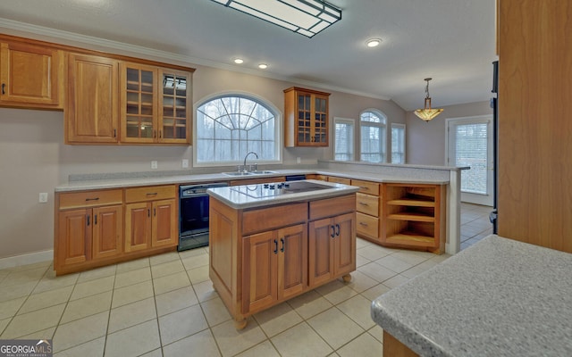 kitchen with glass insert cabinets, a center island, light countertops, and black appliances