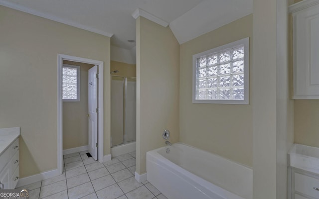 bathroom with a stall shower, vanity, a bath, and tile patterned floors