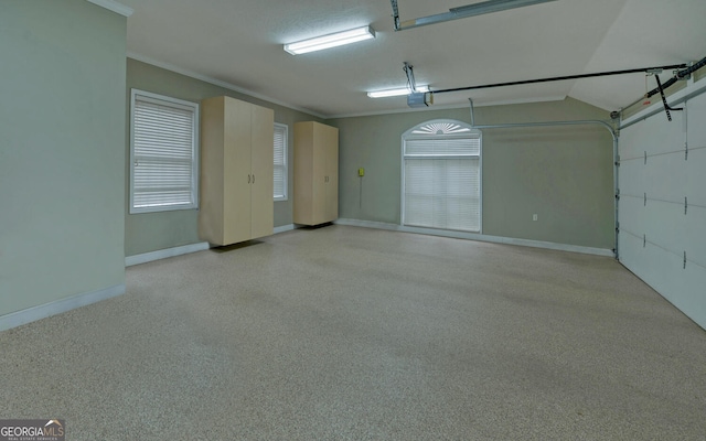 garage with baseboards and a garage door opener