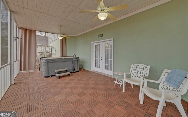 sunroom with ceiling fan and french doors