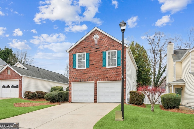 view of property with a garage and a front yard