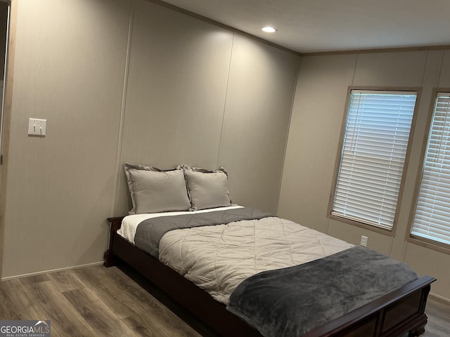 bedroom with hardwood / wood-style floors