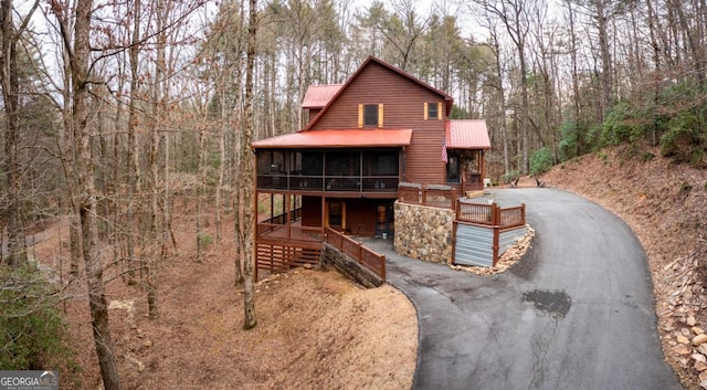 view of front of house with a sunroom