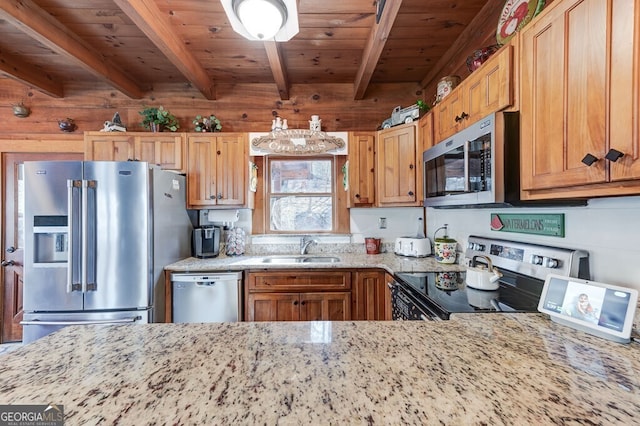 kitchen with appliances with stainless steel finishes, sink, light stone counters, wooden ceiling, and beam ceiling