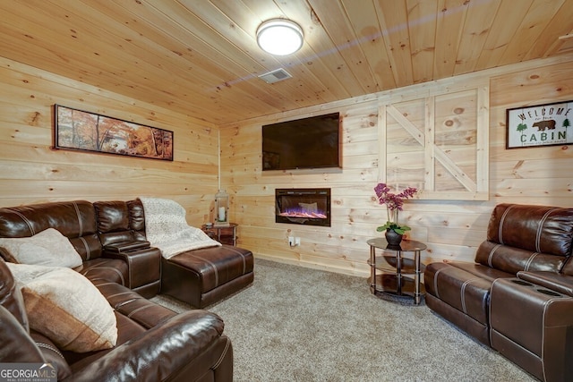 living room featuring carpet flooring, wooden ceiling, and wooden walls