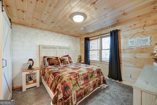 carpeted bedroom featuring wood walls and wooden ceiling