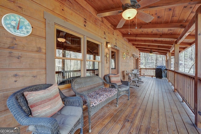 wooden terrace with ceiling fan, a porch, and a grill