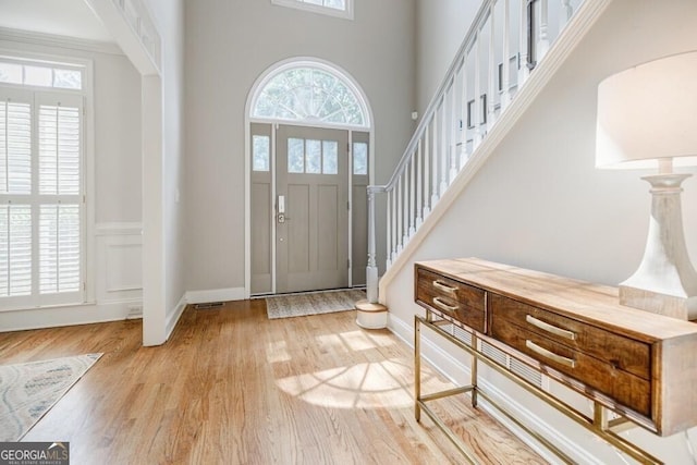 entrance foyer featuring a wealth of natural light and light wood-type flooring