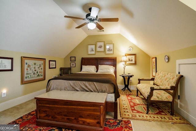 carpeted bedroom featuring lofted ceiling and ceiling fan