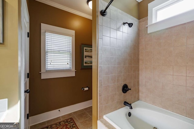 bathroom featuring crown molding, tile patterned flooring, and tiled shower / bath combo