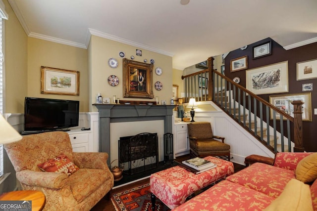 living room featuring hardwood / wood-style floors and ornamental molding