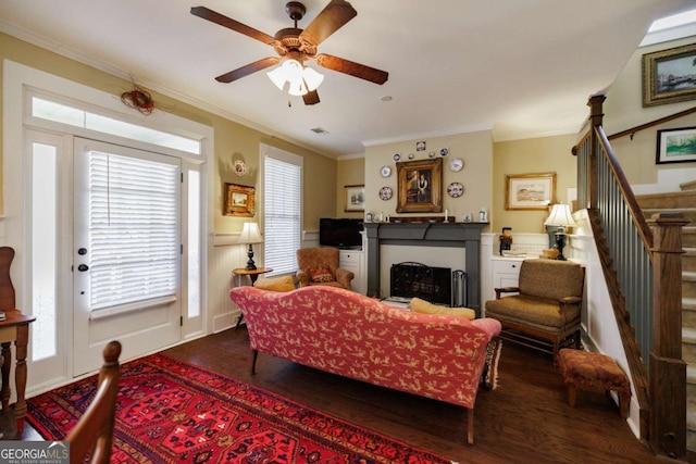 living room featuring ornamental molding, ceiling fan, and dark hardwood / wood-style flooring