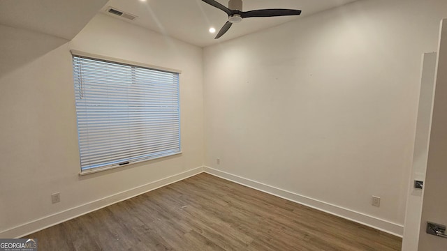 empty room featuring dark hardwood / wood-style floors and ceiling fan