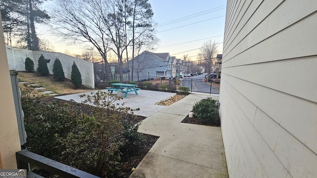 view of patio terrace at dusk