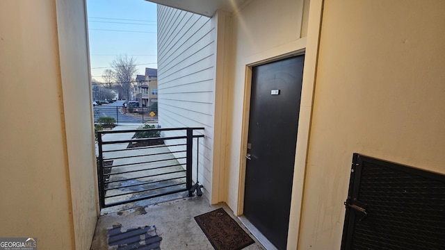 doorway to property featuring a balcony