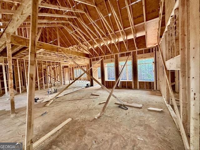 miscellaneous room featuring lofted ceiling