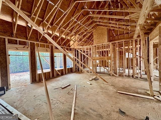 misc room with lofted ceiling