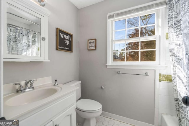 full bathroom with vanity, toilet, and shower / bath combo with shower curtain