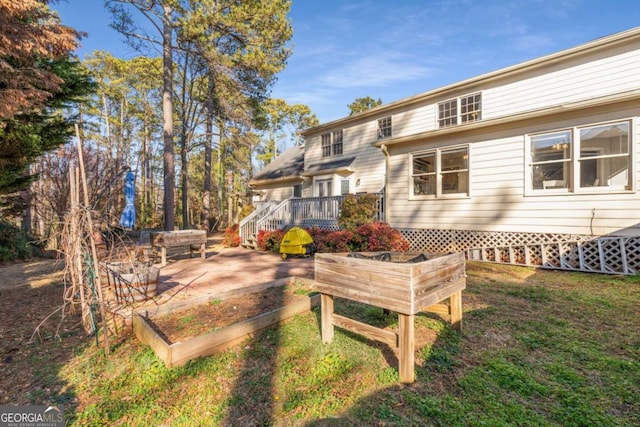 rear view of property with a deck