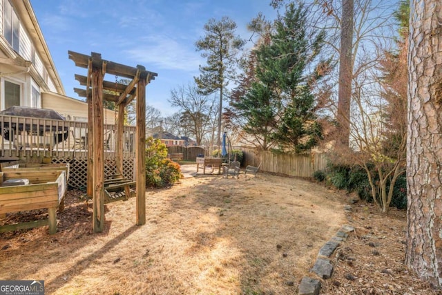 view of yard featuring a wooden deck