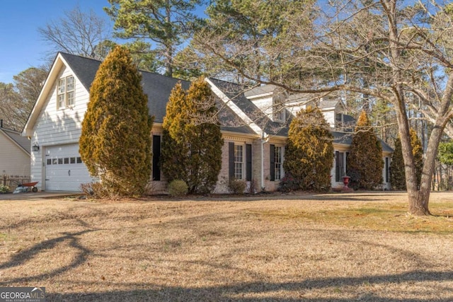 view of front facade with a garage and a front yard