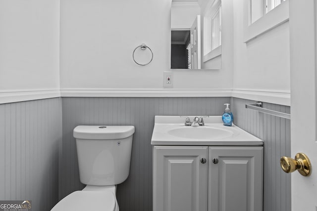 757 Sparta Hwy, Eatonton, GA 31024 - half bath with toilet, a wainscoted wall, and vanity