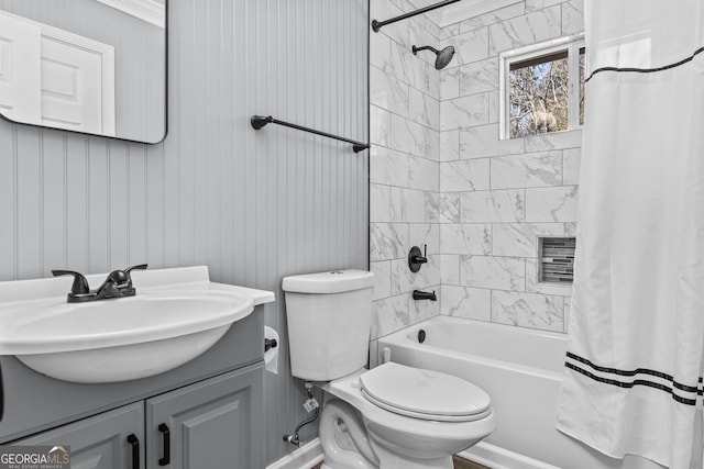 full bathroom featuring vanity, shower / bathtub combination with curtain, and toilet