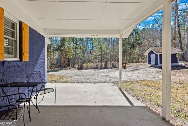 view of patio with a storage unit