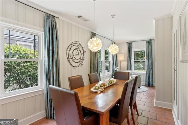 dining room with crown molding