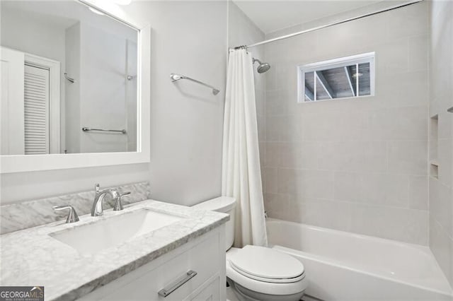 full bathroom with vanity, toilet, and shower / tub combo with curtain