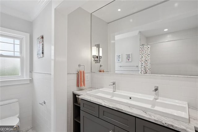 bathroom featuring vanity, tile walls, a shower with shower curtain, and toilet