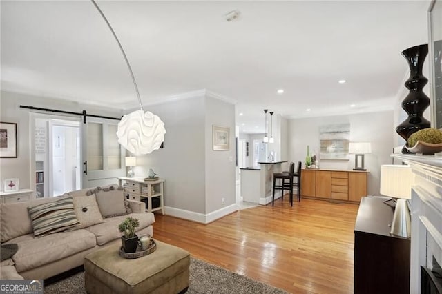 living room with hardwood / wood-style floors and a barn door