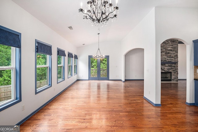 2753 Jubilee Ter, Bethlehem, GA 30620 - unfurnished dining area featuring a chandelier, healthy amount of natural light, wood finished floors, and vaulted ceiling