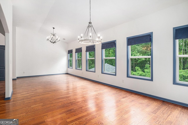2753 Jubilee Ter, Bethlehem, GA 30620 - unfurnished room featuring a chandelier, wood finished floors, and lofted ceiling