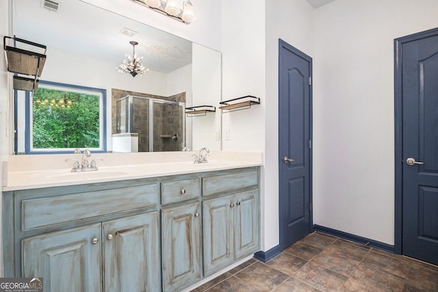 2753 Jubilee Ter, Bethlehem, GA 30620 - bathroom with a shower stall, a chandelier, and double vanity