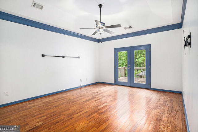 2753 Jubilee Ter, Bethlehem, GA 30620 - unfurnished room featuring hardwood / wood-style flooring, french doors, ceiling fan, and a tray ceiling