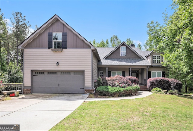 2753 Jubilee Ter, Bethlehem, GA 30620 - craftsman-style home with a front lawn, driveway, board and batten siding, an attached garage, and covered porch