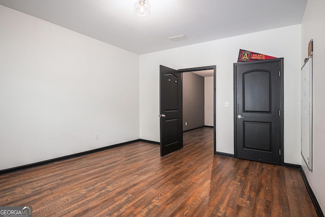 2753 Jubilee Ter, Bethlehem, GA 30620 - unfurnished bedroom featuring dark wood-style flooring and baseboards
