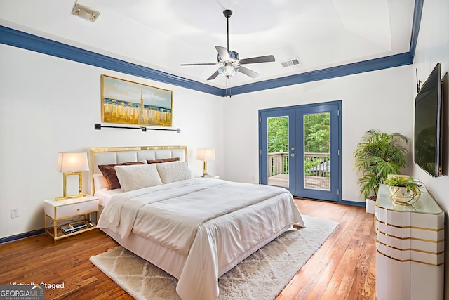 2753 Jubilee Ter, Bethlehem, GA 30620 - bedroom featuring access to exterior, hardwood / wood-style floors, french doors, and a raised ceiling