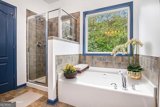 2753 Jubilee Ter, Bethlehem, GA 30620 - bathroom featuring healthy amount of natural light, a garden tub, and a shower stall