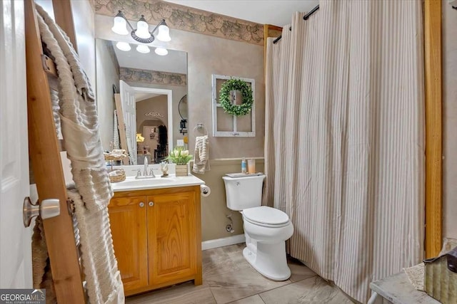 bathroom featuring vanity, a shower with curtain, and toilet