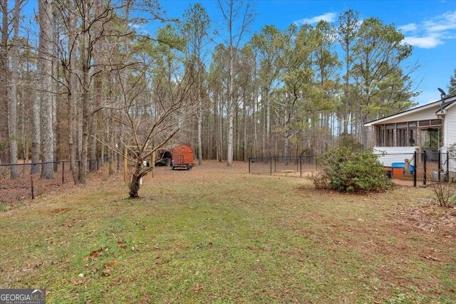 view of yard with a sunroom