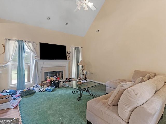 living room featuring ceiling fan and high vaulted ceiling