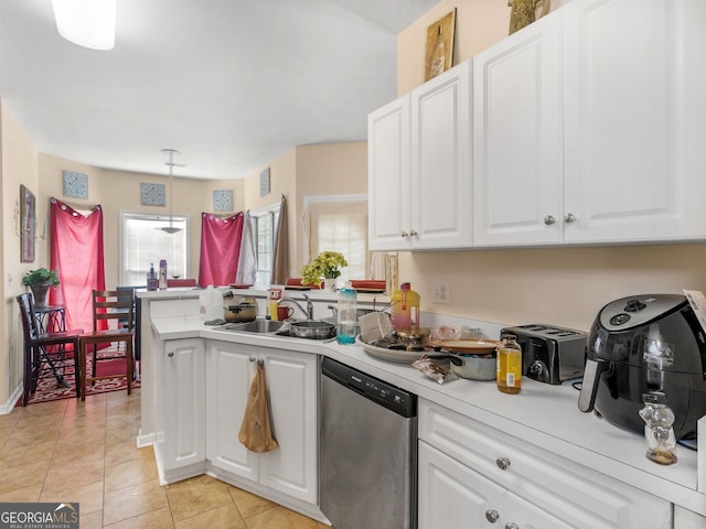 kitchen with dishwasher, sink, white cabinets, and kitchen peninsula