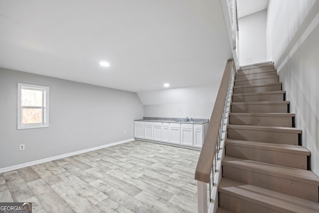 interior space featuring sink and light wood-type flooring