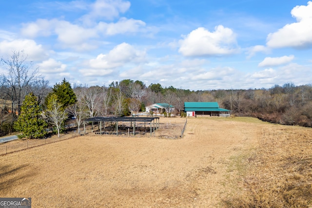 view of yard with a rural view